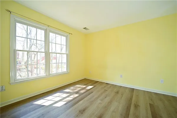 a bathroom with a shower and a sink