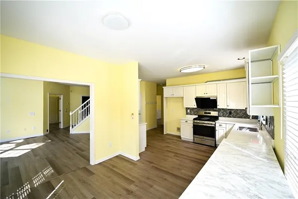 a kitchen with a sink a stove and refrigerator
