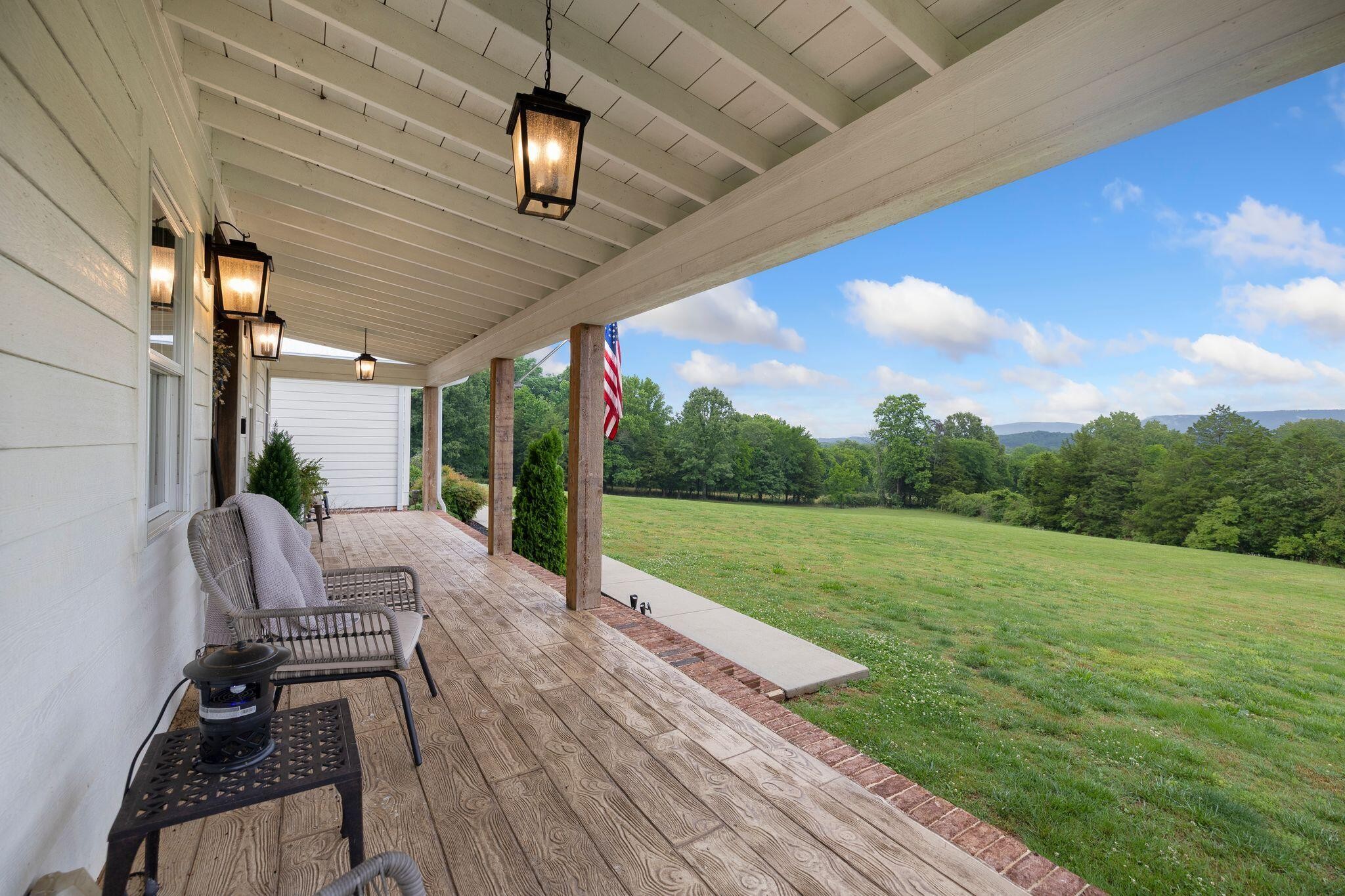 6866 Daus Mountain Road Whitwell, TN 37397 - Photo 3 of 49 a view of a porch with furniture and garden