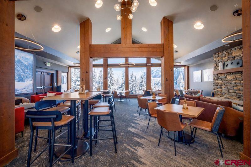 93 Travertine Trail Durango, CO 81301 - Photo 39 of 44 a view of a dining room with furniture window and wooden floor