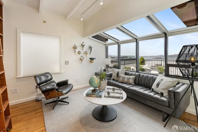 a view of a terrace with chairs and potted plants