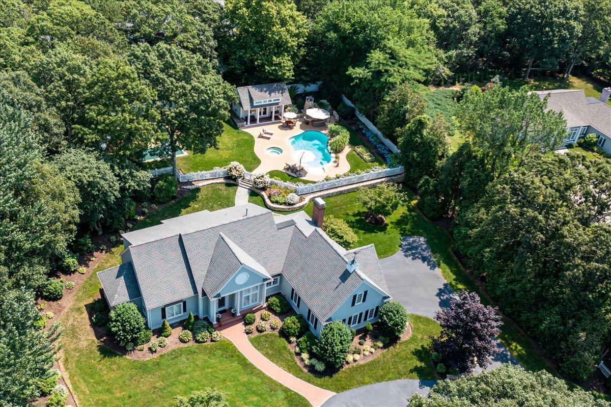 1490 South County Road Osterville, MA 02655 - Photo 1 of 75 an aerial view of a house with a yard swimming pool a patio and yard