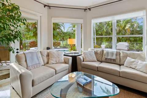 a en suite bathroom with a granite countertop sink and a mirror