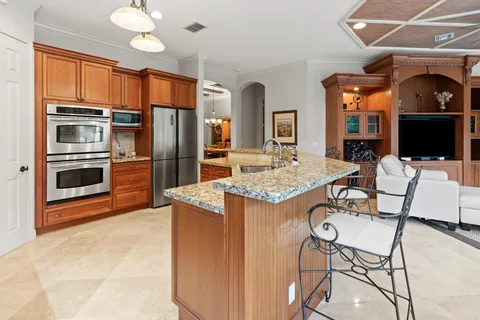 a large bed sitting in a bedroom next to a window