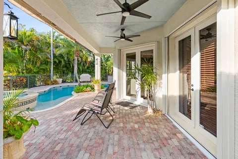 a view of swimming pool with a patio