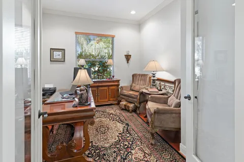 a group of people sitting in a living room