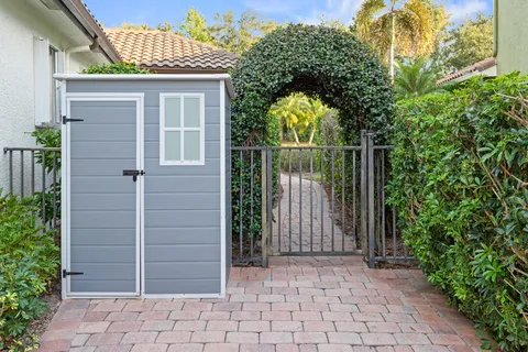 a view of a lake with houses in back