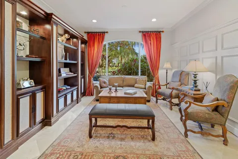 a balcony view with a table and chairs