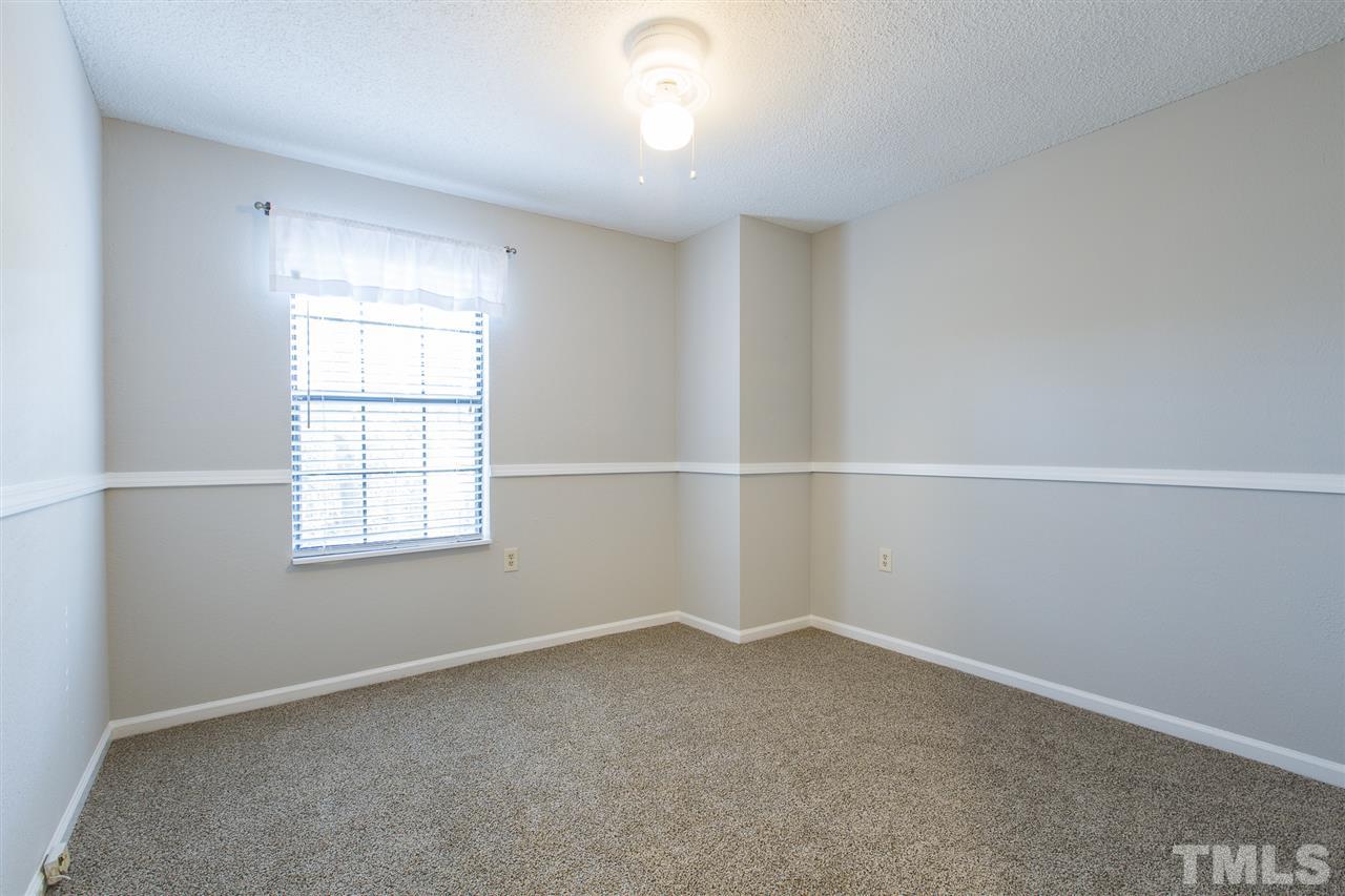 2451 Condor Court Raleigh, NC 27615 - Photo 22 of 23 an empty room with a window