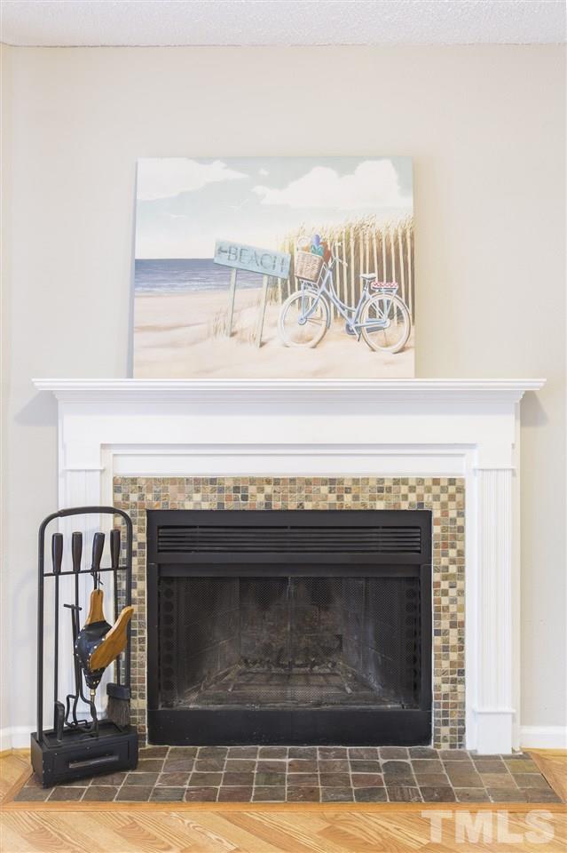 2451 Condor Court Raleigh, NC 27615 - Photo 8 of 23 a close view of fireplace and a hallway