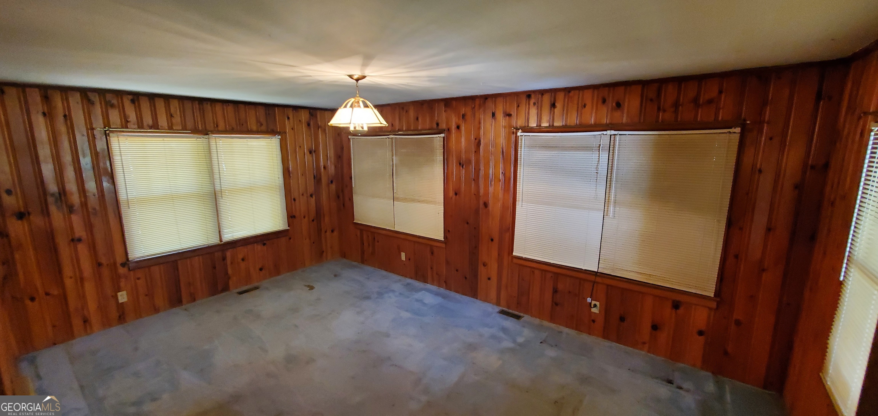 1061 Burger Road Watkinsville, GA 30677 - Photo 36 of 43 an empty room with windows cabinet and door