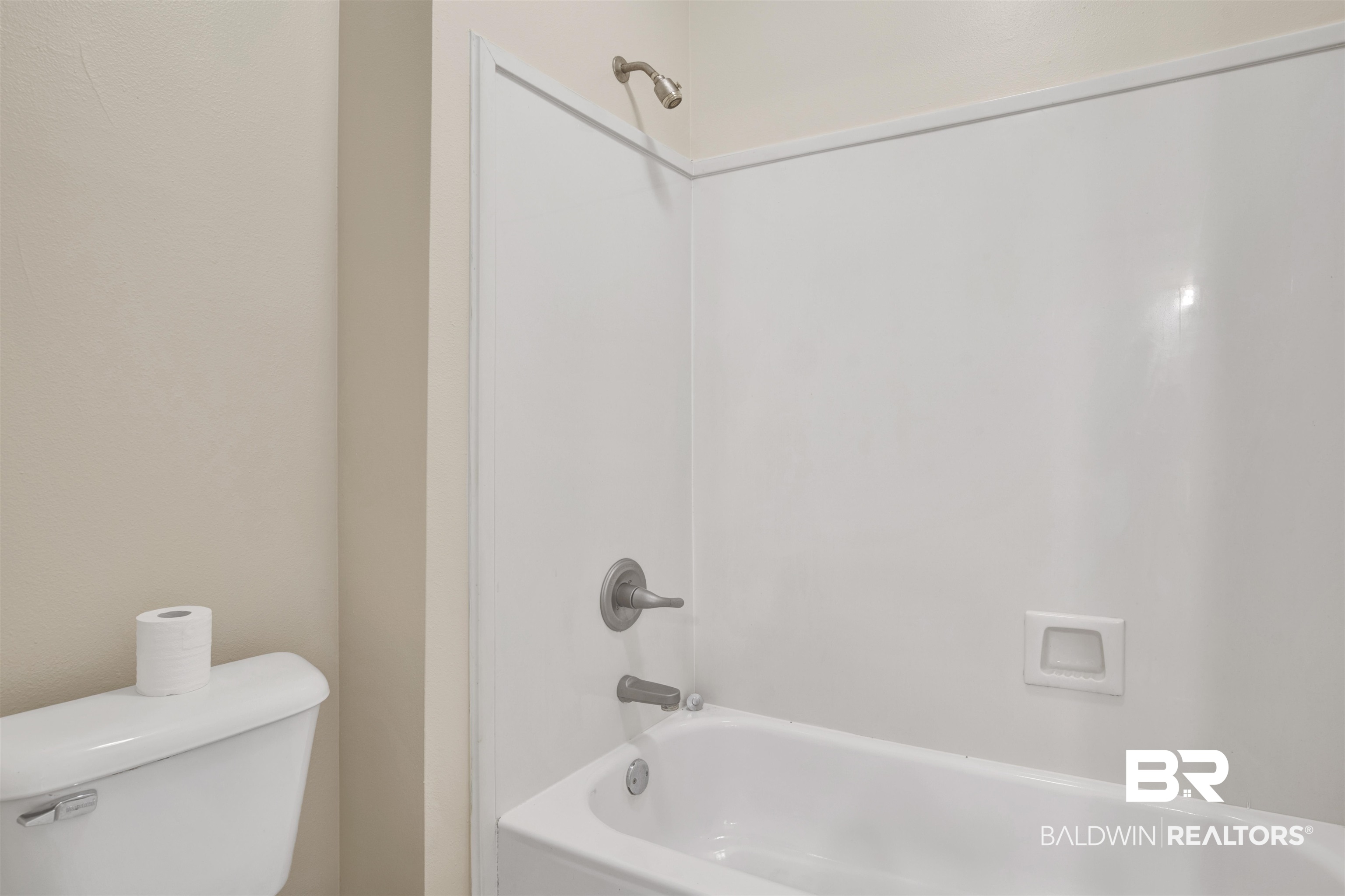 8847 Dawes Lake Road South Mobile, AL 36619 - Photo 18 of 47 White tub-shower combination with brushed nickel fixtures and integrated soap dish