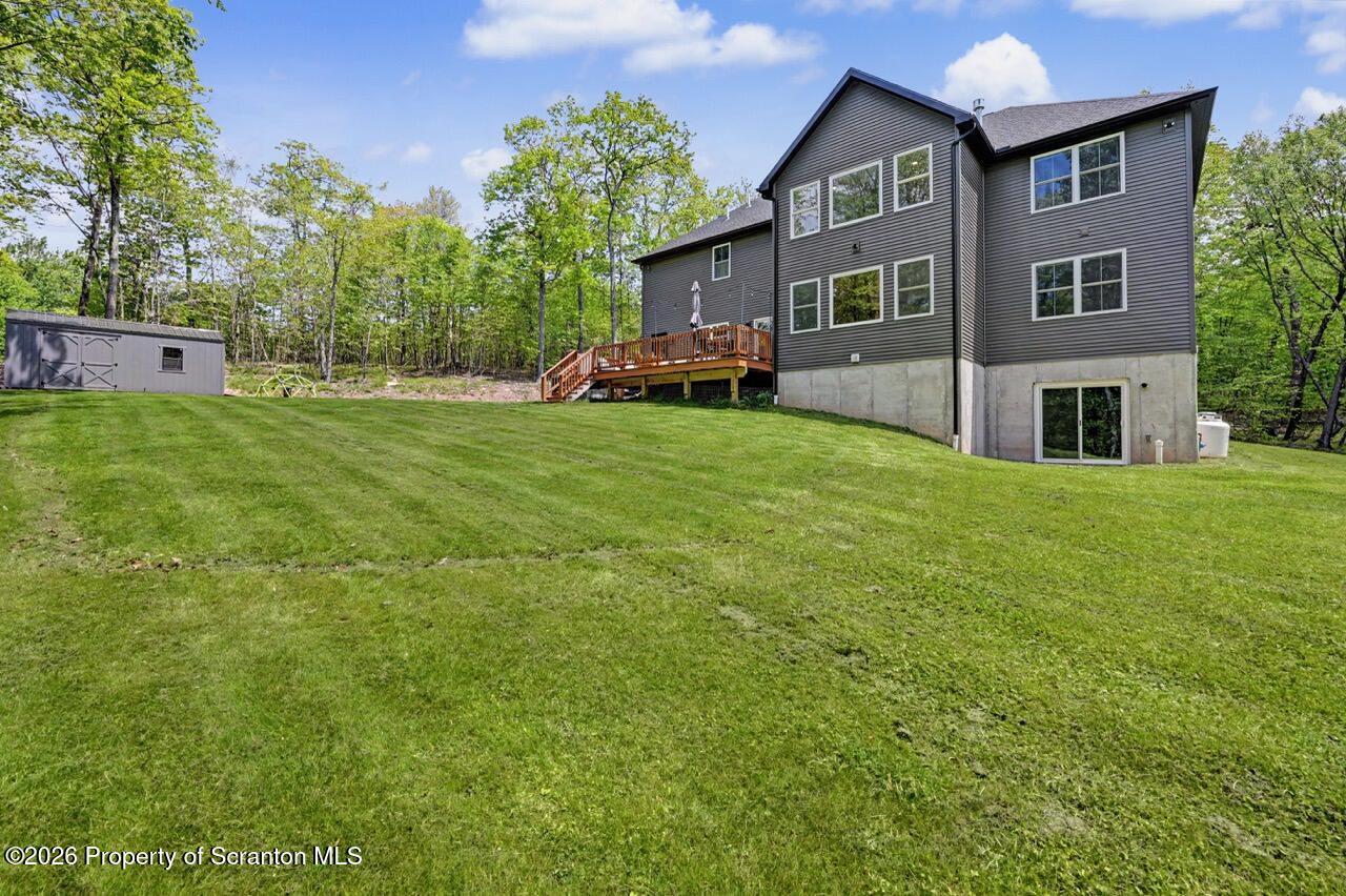 100 Highland Road Moscow, PA 18444 - Photo 80 of 85 a front view of house with yard and trees