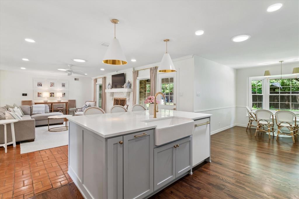 11439 Rosser Road Dallas, TX 75229 - Photo 12 of 35 a kitchen with a sink counter top space and living room view