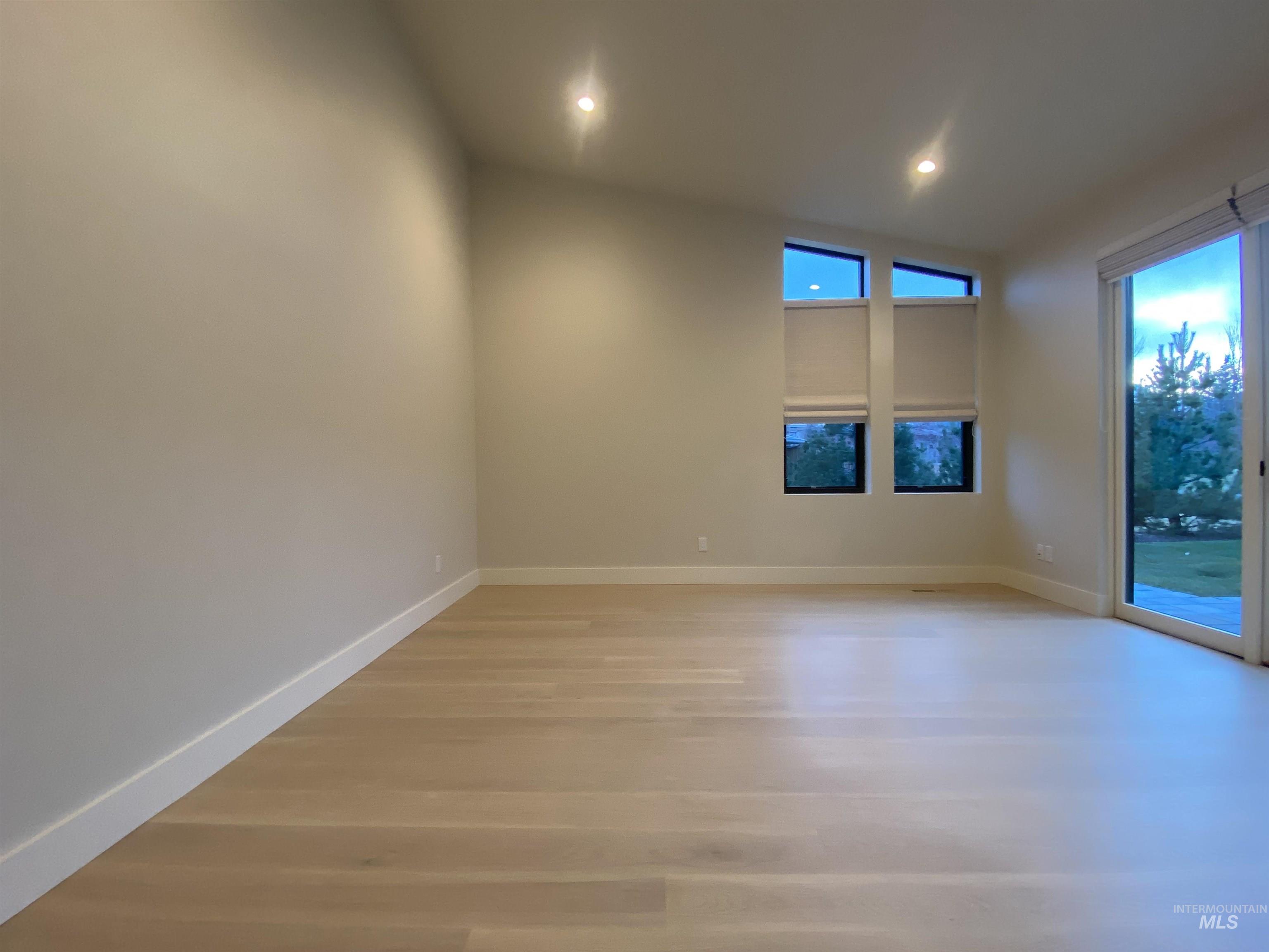 27 Streamside Drive Hailey, ID 83333 - Photo 14 of 39 Spare room featuring light wood-style flooring, recessed lighting, and lofted ceiling