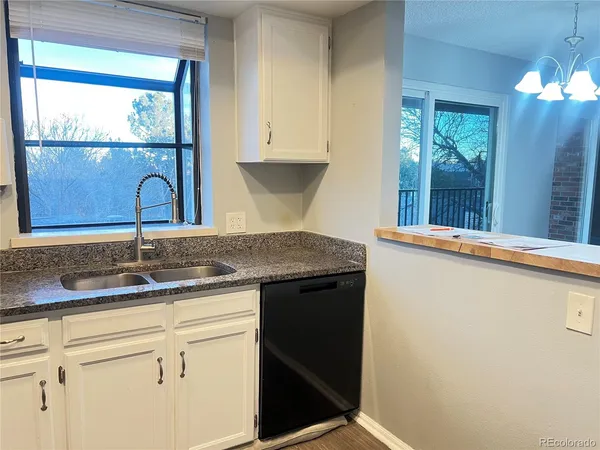 a kitchen with a sink and a window