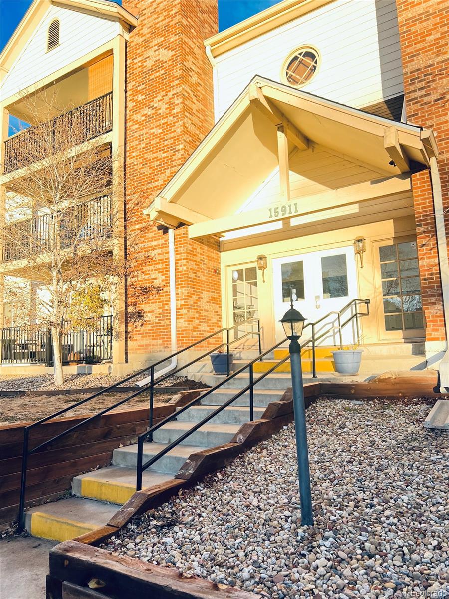 15911 East Dakota Place, Unit 301 Aurora, CO 80017 - Photo 5 of 18 a house view with a outdoor space