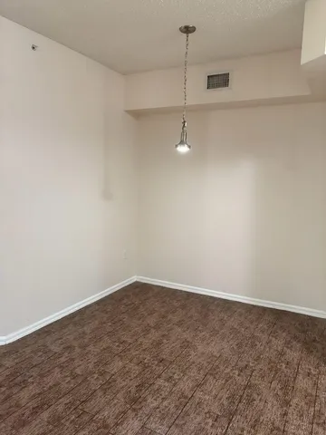 a view of a room with an empty space