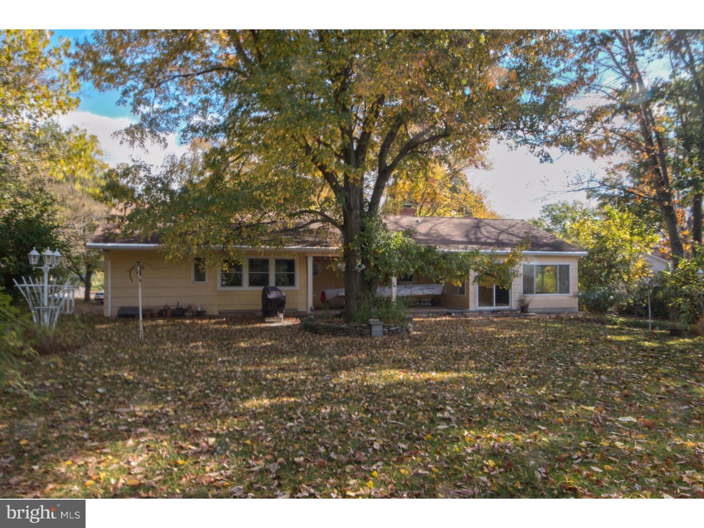 384 Walnut Lane Princeton, NJ 08540 - Photo 13 of 14 a view of a yard in front of a house with large trees