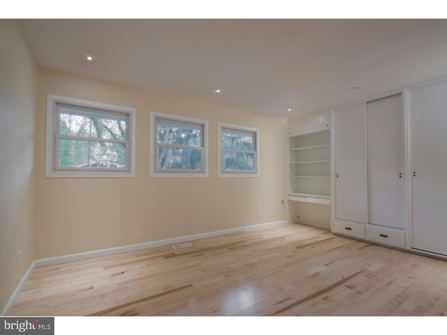 384 Walnut Lane Princeton, NJ 08540 - Photo 9 of 14 a view of an empty room with wooden floor and a window