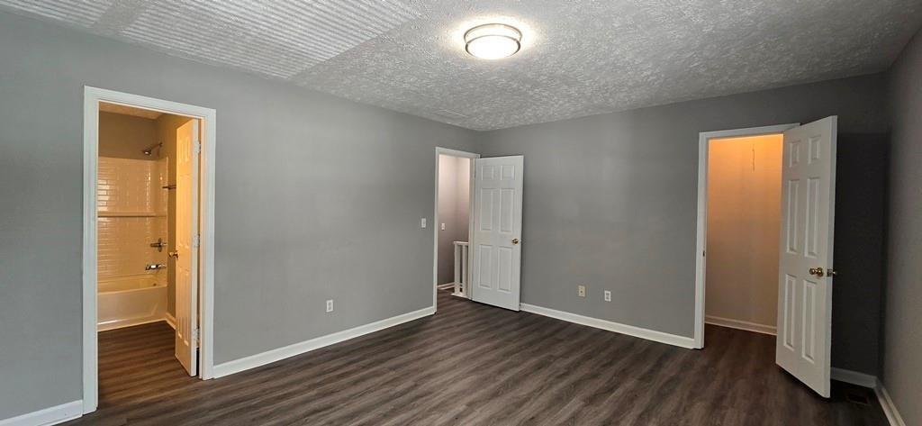 1020 Dassow Court Alpharetta, GA 30009 - Photo 12 of 18 an empty room with wooden floor and windows