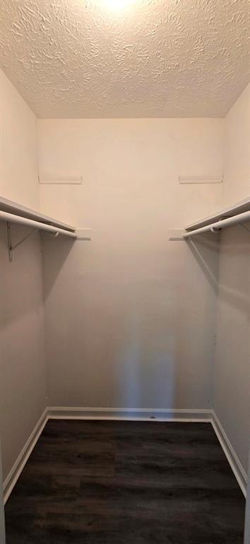 1020 Dassow Court Alpharetta, GA 30009 - Photo 13 of 18 a view of an empty walk in closet