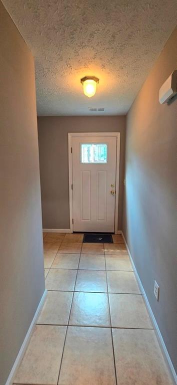 1020 Dassow Court Alpharetta, GA 30009 - Photo 2 of 18 a view of a hallway with wooden floor and a bathroom