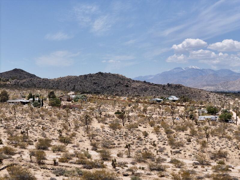 7608 Olympic Road Joshua Tree, CA 92252 - Photo 20 of 26 an aerial view of houses covered in trees