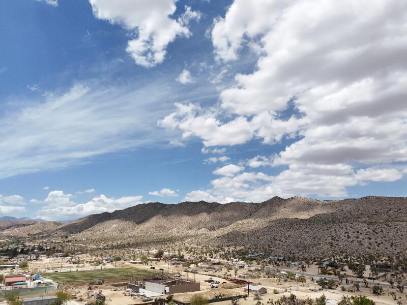 7608 Olympic Road Joshua Tree, CA 92252 - Photo 25 of 26 a view of a city with mountains in the background
