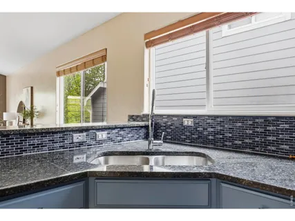 a kitchen with a sink and a window