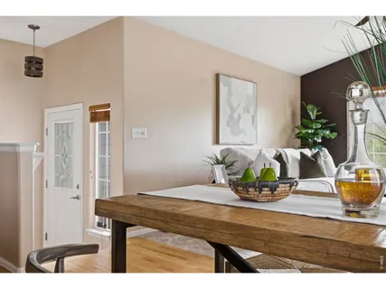 a dining room with furniture and window
