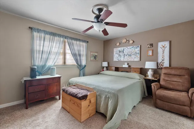 a bed room with a bed and a couch