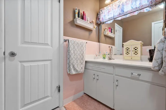 a bathroom with a sink and a mirror