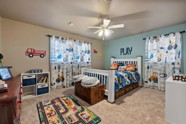 a bedroom with furniture and a chandelier
