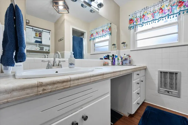 a bathroom with a sink and a mirror