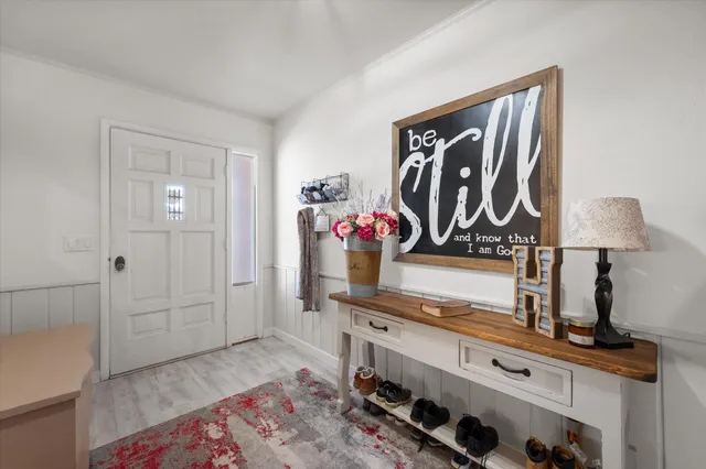 a view of a livingroom with wooden floor and closet