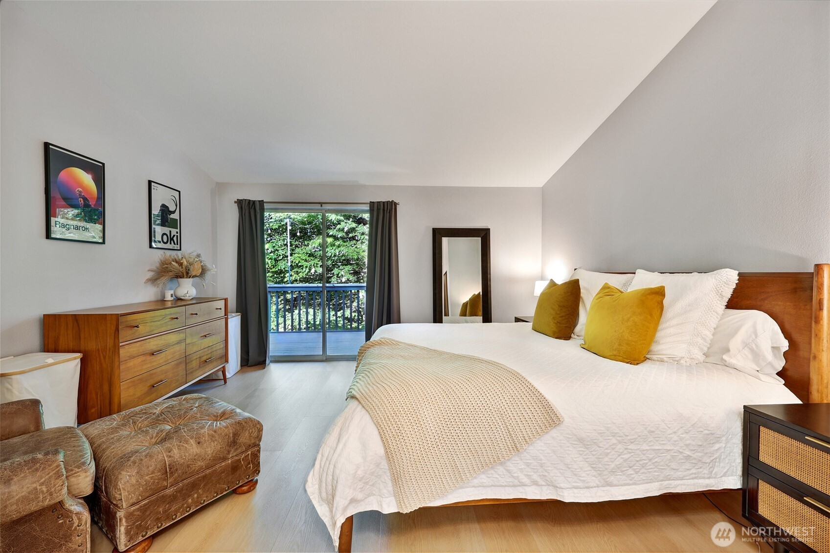 5126 South Garden Loop Road, Unit 11 Seattle, WA 98118 - Photo 19 of 36 a spacious bedroom with a bed and window
