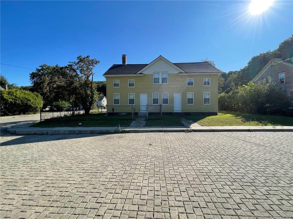 81 Rive River Street, Unit 81 Baltic, CT 06330 - Photo 1 of 1 a front view of a house with a yard