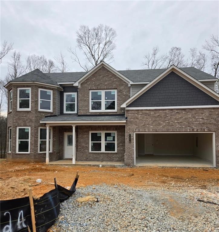 2226 Sun Valley Buford, GA 30519 - Photo 2 of 22 a front view of a house with a yard