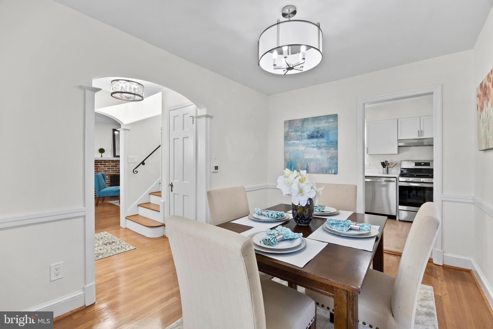 31 McDonald Place Northeast Washington, DC 20011 - Photo 11 of 45 a view of a dining room with furniture and wooden floor