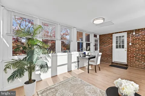 a view of a livingroom with furniture and a potted plant