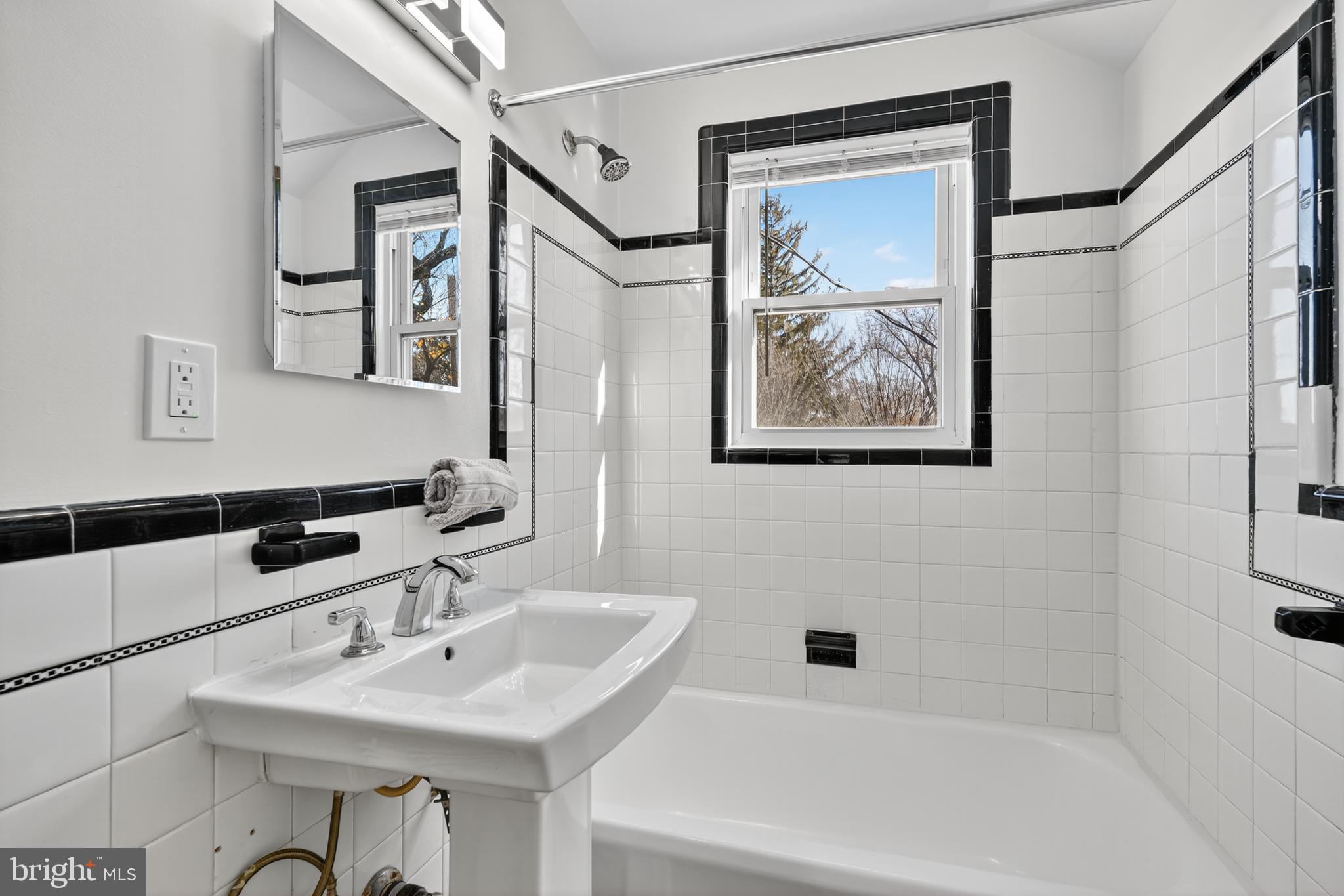 31 McDonald Place Northeast Washington, DC 20011 - Photo 24 of 45 a bathroom with a sink and a bathtub