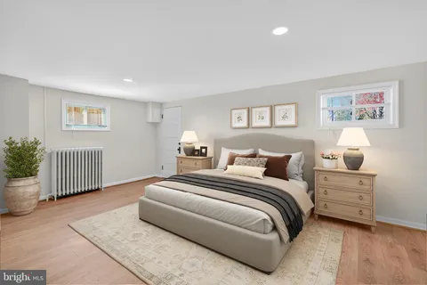 a bedroom with a bed and a couch