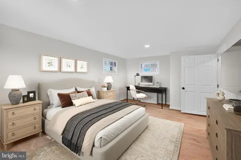 a bedroom with a bed and a couch