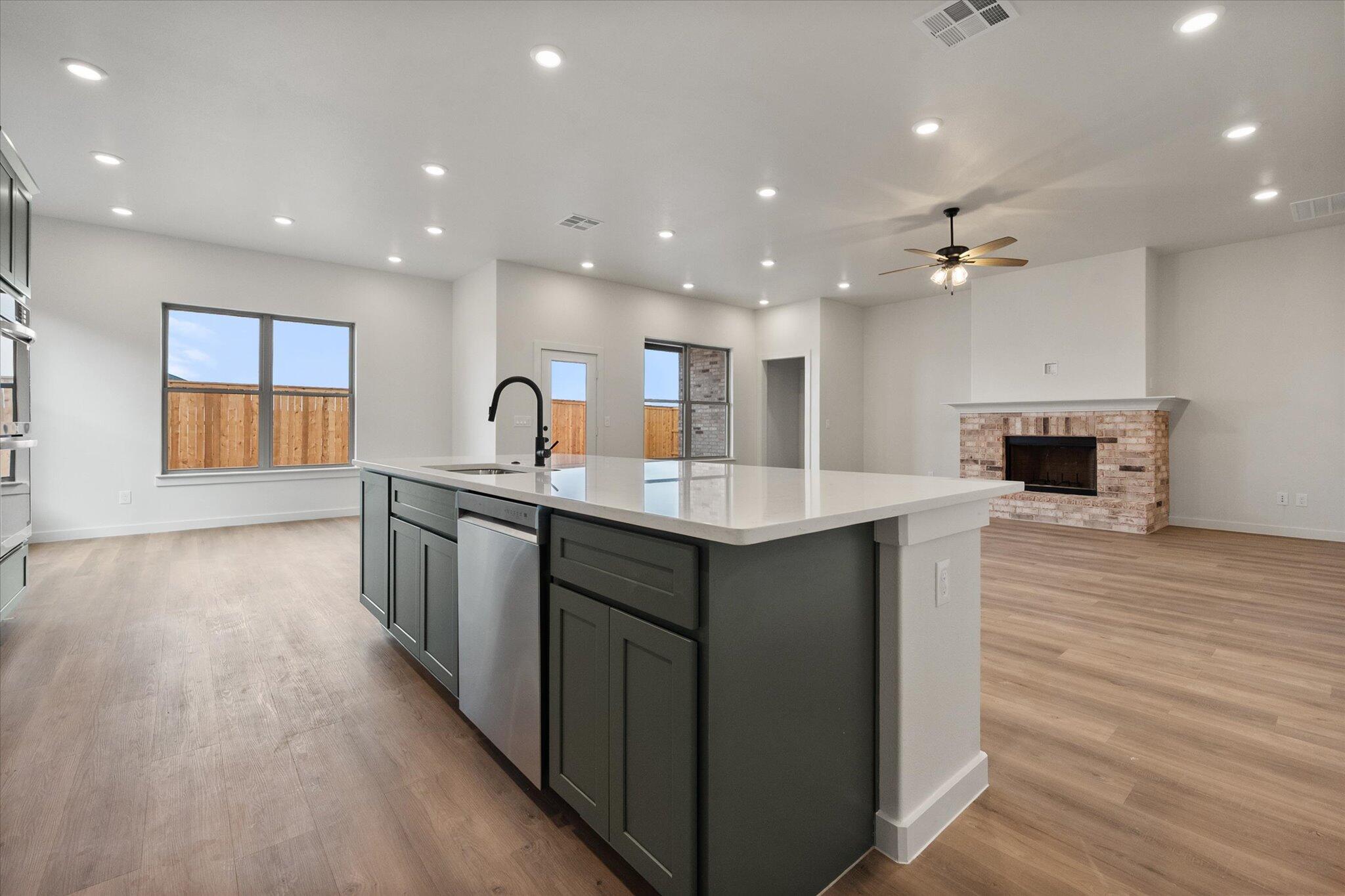 2901 Tractor Avenue Wolfforth, TX 79382 - Photo 11 of 25 a kitchen with counter top space and windows