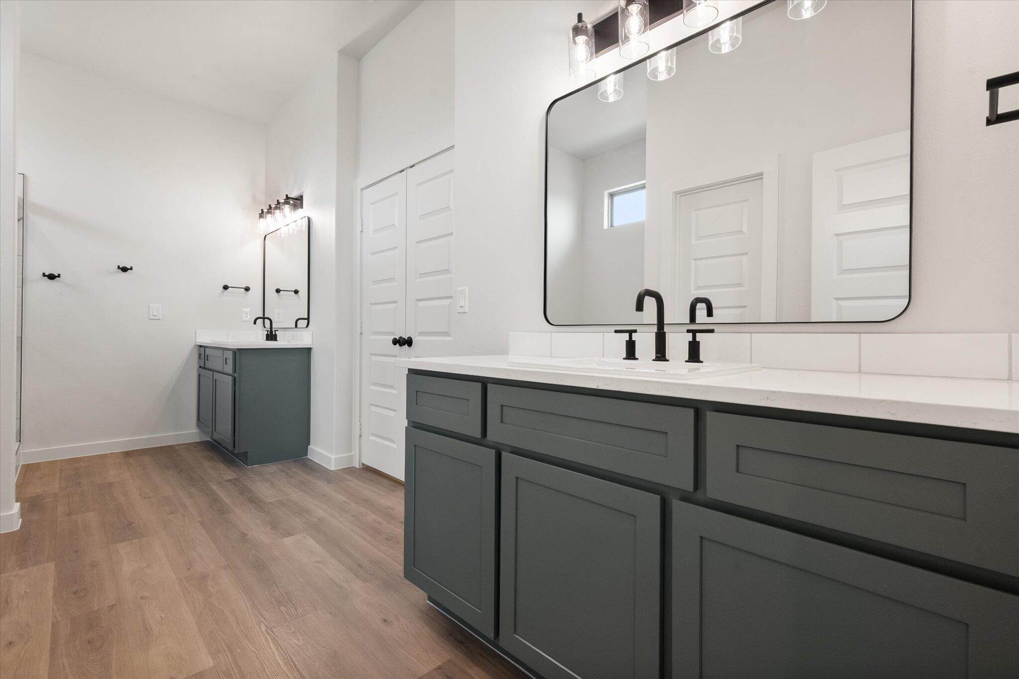 2901 Tractor Avenue Wolfforth, TX 79382 - Photo 14 of 25 a bathroom with a sink and mirror