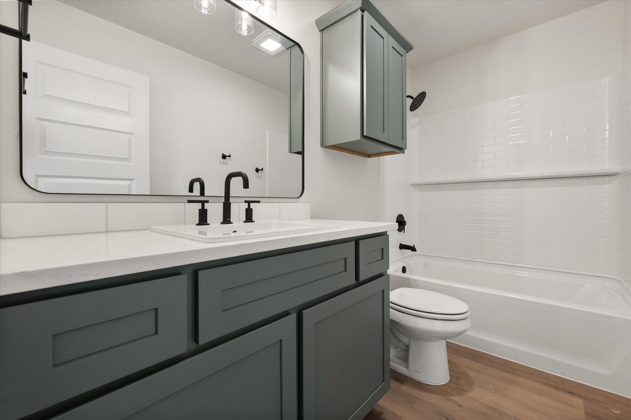 2901 Tractor Avenue Wolfforth, TX 79382 - Photo 22 of 25 a bathroom with a sink toilet and shower