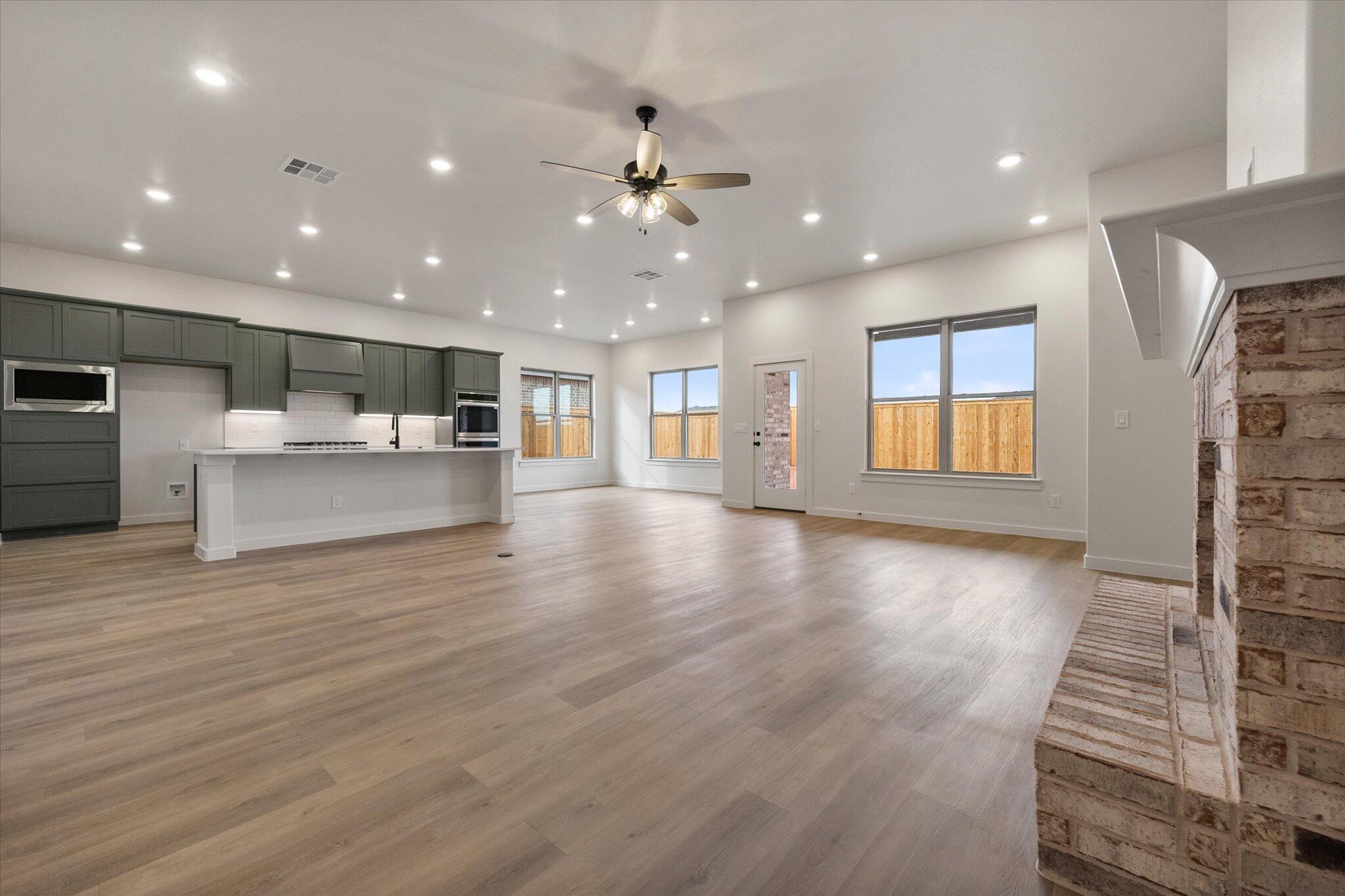 2901 Tractor Avenue Wolfforth, TX 79382 - Photo 3 of 25 a view of a kitchen with a sink and a large window