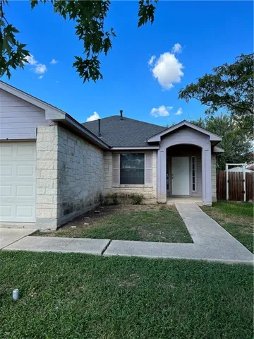 a view of front of a house with a yard