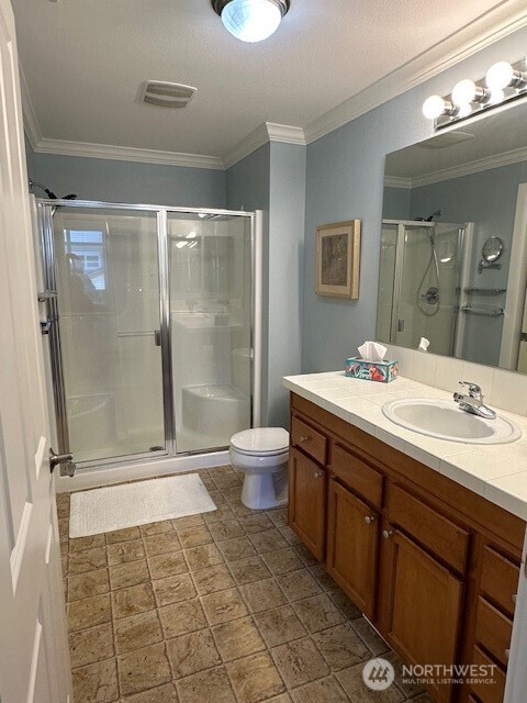 23943 Northeast 115th Lane, Unit 204 Redmond, WA 98053 - Photo 11 of 24 a bathroom with a double vanity sink toilet and shower